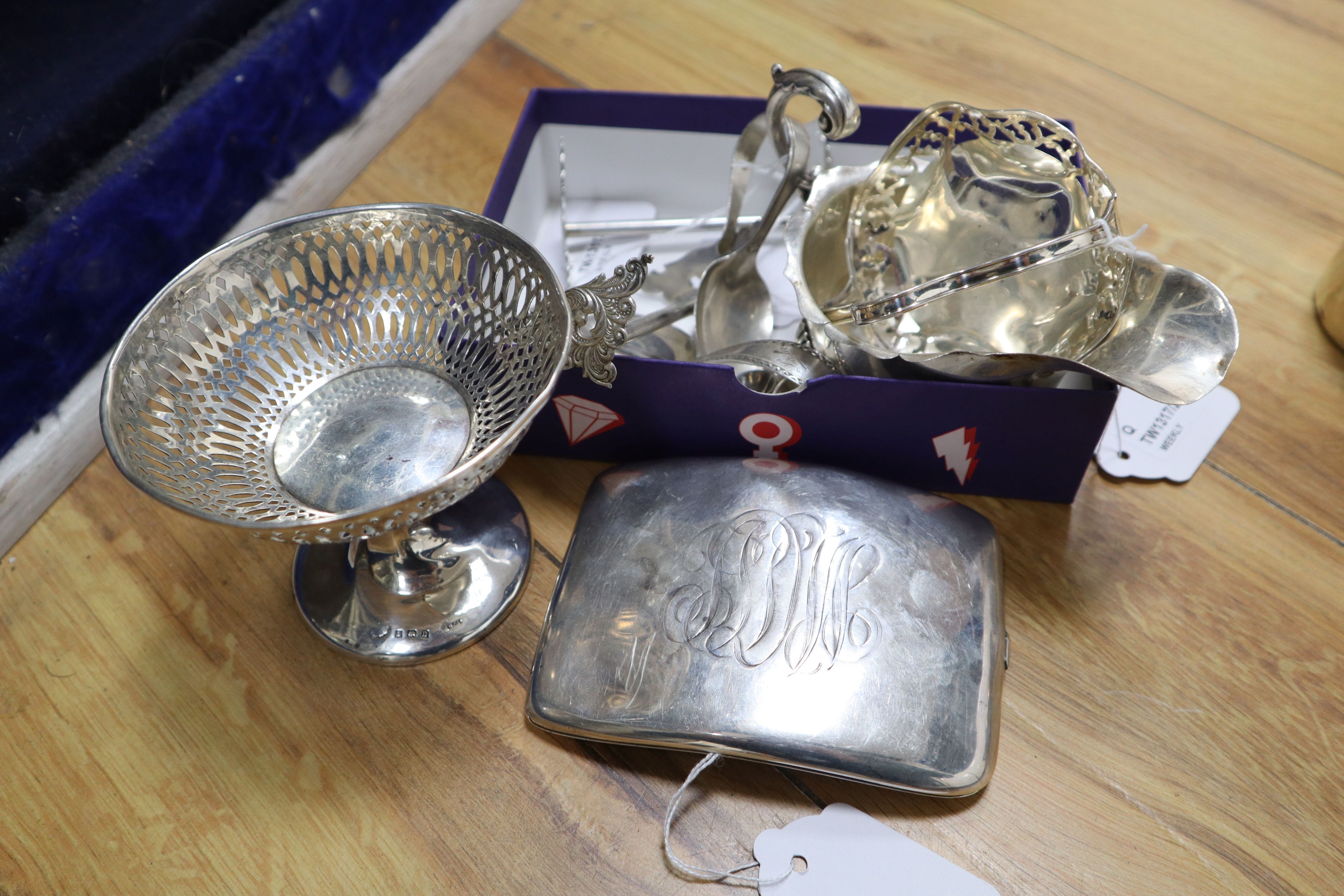 A Sterling silver cigarette case, a sauce boat and sundry silver,